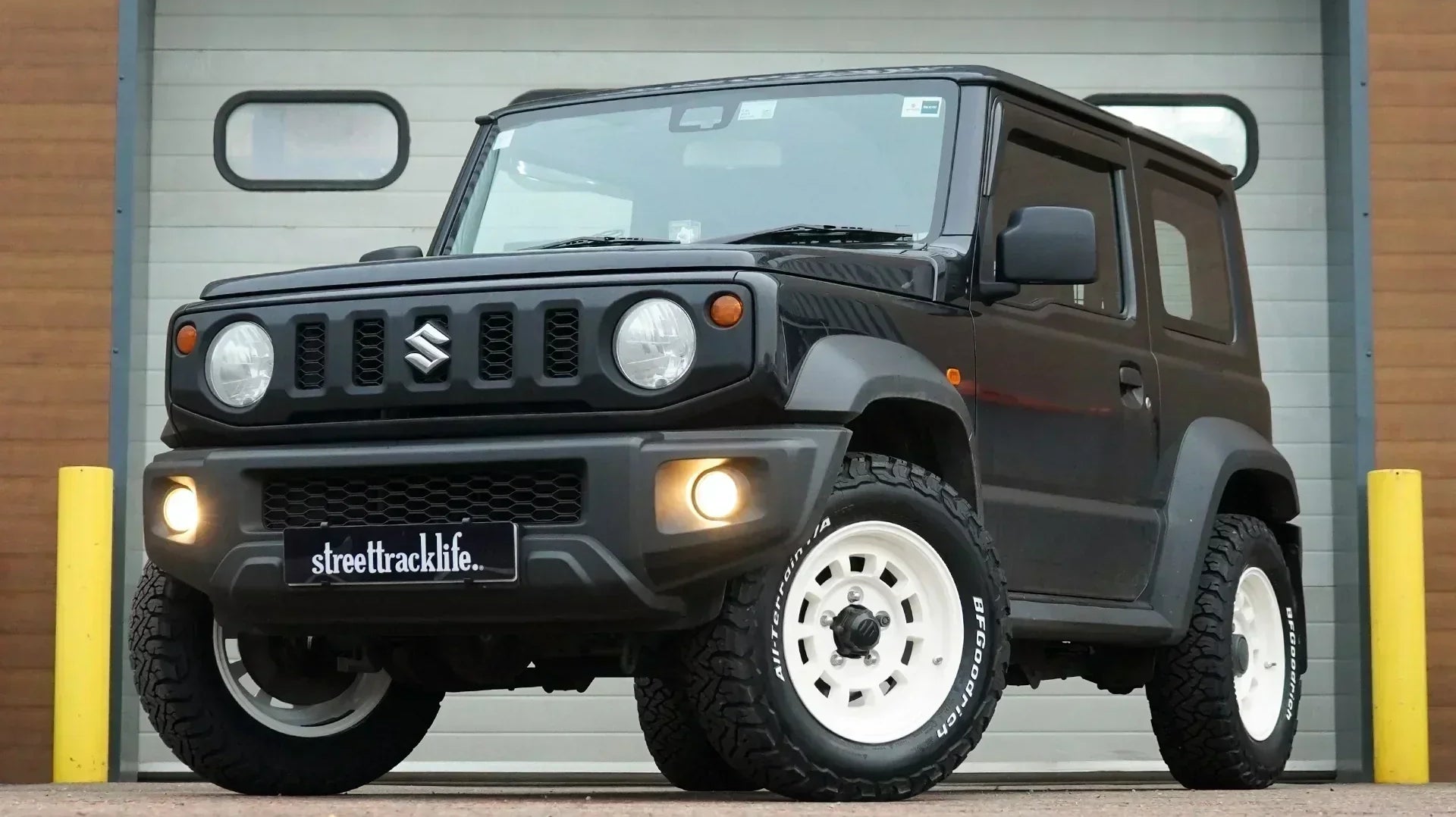 Black Suzuki Jimny we kitted out with Vintage White Retro style wheels, all terrain tyres and interior accessories at our Holmes Chapel workshop!