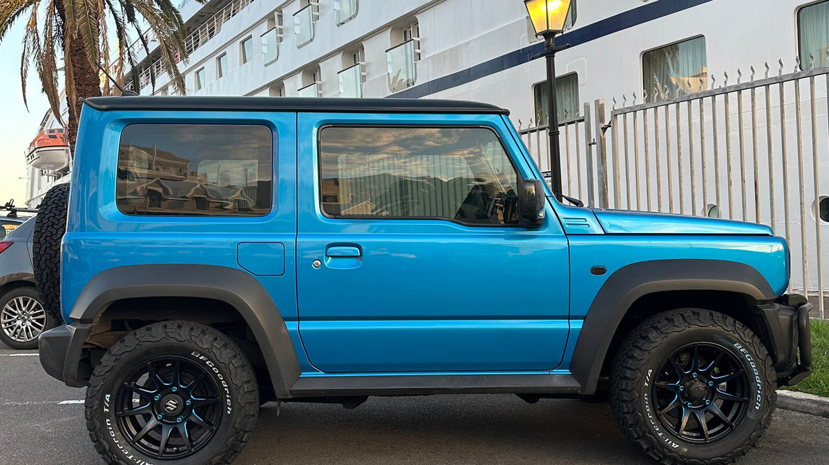 Blue Suzuki Jimny with 16" CST ZERO1 HYPER XJ in Flat Black with Blue Highlights