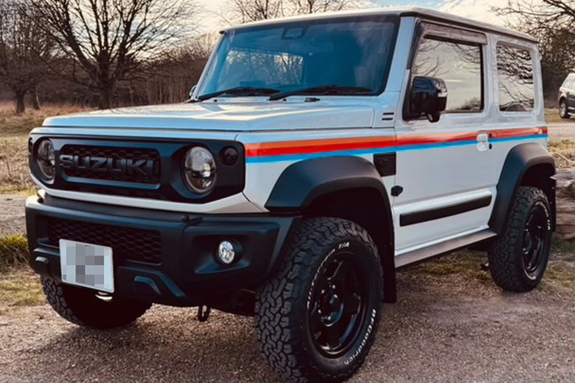 White Jimny fitted with 16" Matte Black BRADLEY V wheels and a variety of accessories