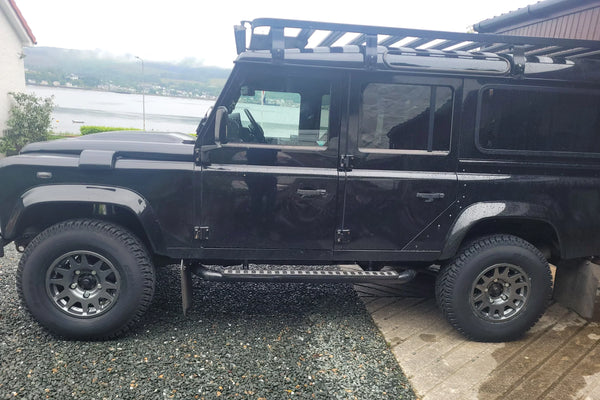 Black Land Rover Defender 110 fitted with EVO Corse DakarZero 16" wheels in Anthracite