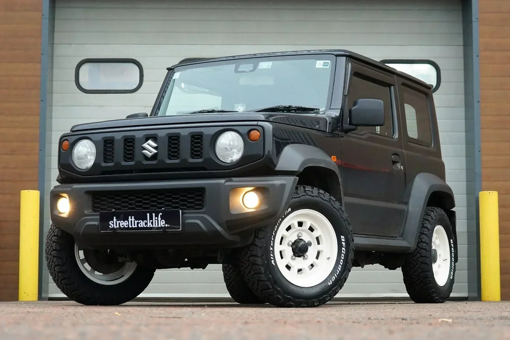 Black Suzuki Jimny we kitted out with Vintage White Retro style wheels, all terrain tyres and interior accessories at our Holmes Chapel workshop!