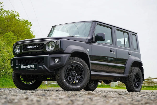 a modified 5-door Jimny with a Jimnystyle  Touring suspension kit, Pipercross air intake, Magpie M-01 wheels and various LED and interior accessories.