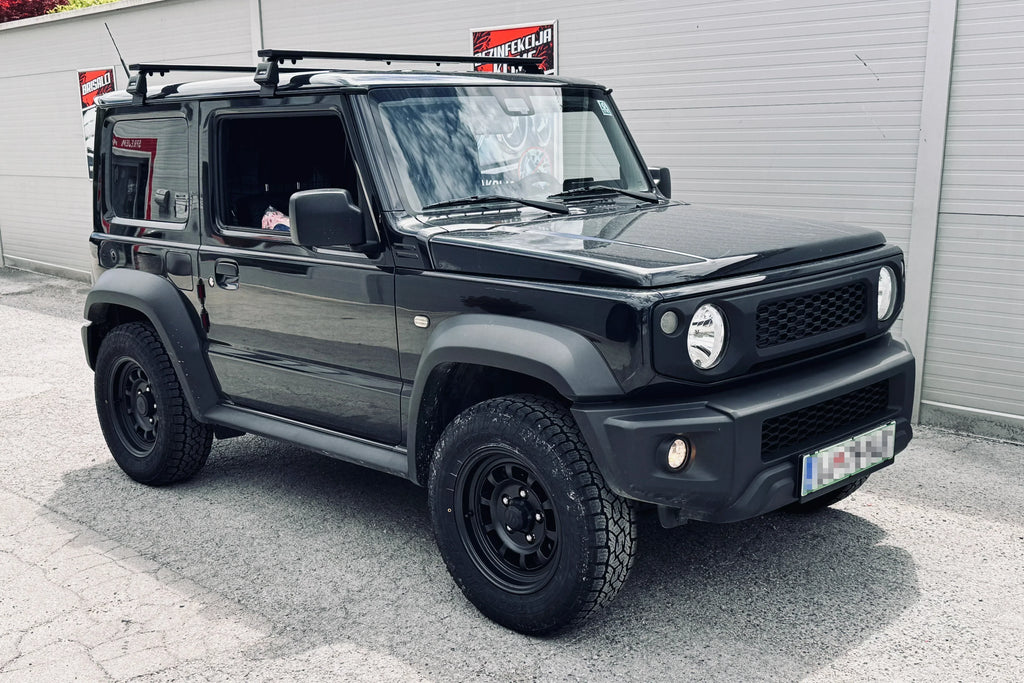 Black Suzuki Jimny (2018+) with Matte Black High Peak J-01 wheels and Retro Front Grille