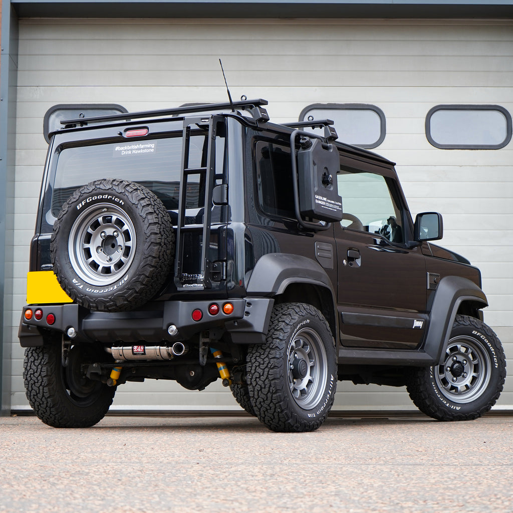 Photo of a Suzuki Jimny with a painted APIO Tactical Rear Bumper for Suzuki Jimny JB74 (2018+) fitted with a Jimy exhaust upgrade. Jimny Body kit modification. 