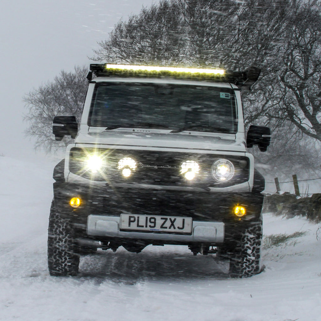 IPF Super Rally LED Spot & Driving Hybrid Lamps with IPF Lamp Stay on a Suzuki Jimny front grille JimnyStyle