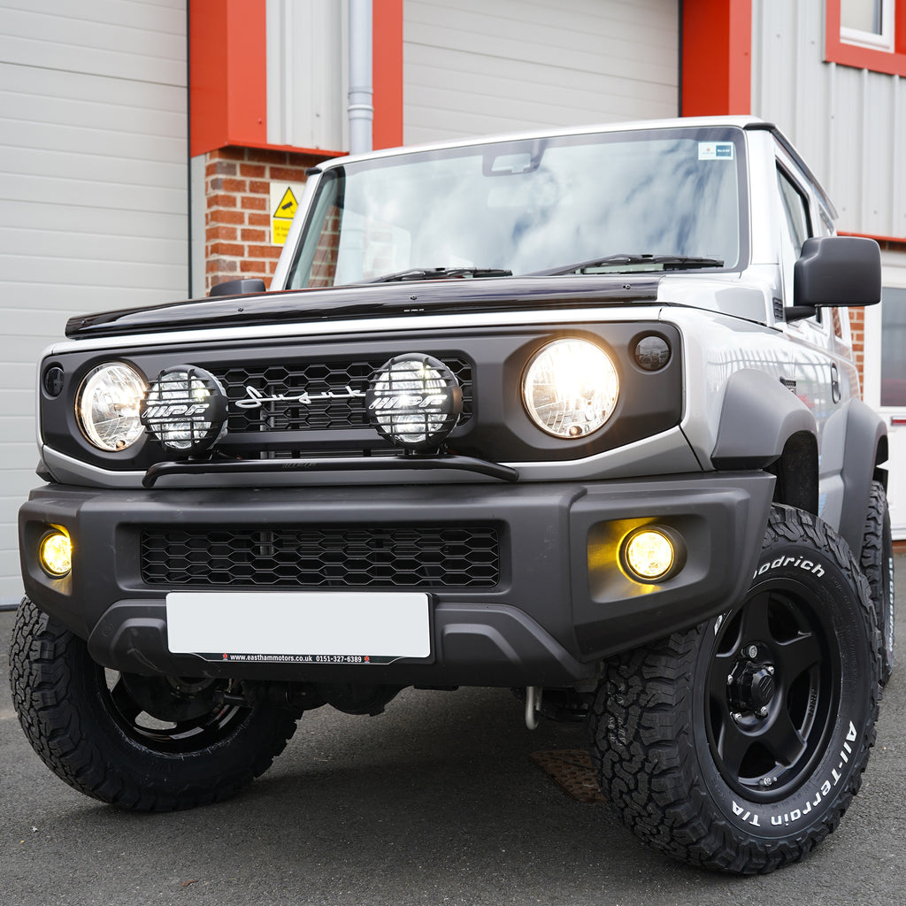 IPF Super Rally LED Spot & Driving Hybrid Lamps with IPF Lamp Stay on a Suzuki Jimny front grille JimnyStyle Street Track Life